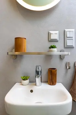 a bathroom with a white sink with plants on it at Old Town 2BR Spacious House with Private Garden and Free Parking in Plovdiv