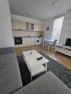 a living room with a couch and a table at Paradise Locked in Sofia