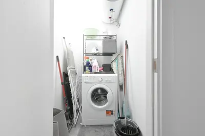 a laundry room with a washing machine in it at Crème Lux - Elegant 1BD in Manastirski Livadi by Flat Manager in Sofia