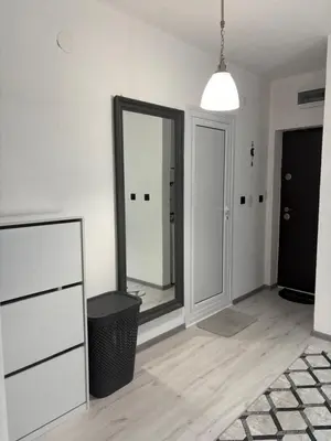 a white room with a mirror and a hallway at Трушеви in Sandanski