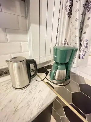a coffee maker on a counter in a kitchen at Bulg Modern in Sofia