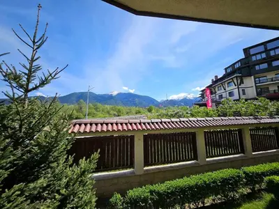 a view of the mountains from a balcony of a building at Luxury apartment in Downtown Resort Bansko in Bansko
