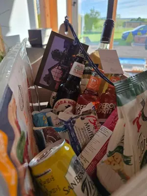 a basket filled with different types of food and drinks at Villa Selya - Private Pool & Mountain View in Selyanin