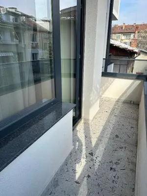 an empty balcony with a view of a building at Milea apartments in Sofia