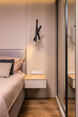a bedroom with a bed and a clock on the wall at TOP Center apt 'Pemena' FREE Private Parking in Plovdiv