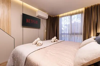 a bedroom with two stuffed animals on a bed at TOP Center apt 'Pemena' FREE Private Parking in Plovdiv