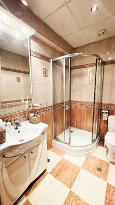 a bathroom with a shower and a sink and a toilet at The Executive Escape Sofia in Sofia
