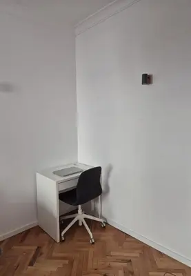 an empty office with a desk and a chair at Apartament 151 in Sofia