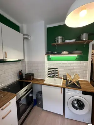 a kitchen with a washing machine and a sink at Apartament 151 in Sofia