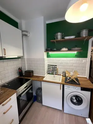 a kitchen with a sink and a washing machine at Apartament 151 in Sofia