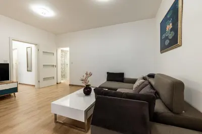 a living room with a couch and a coffee table at Finest 3BR Downtown in Sofia