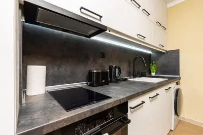 a kitchen with a sink and a stove at Central Chic 1BD Apt Near Kapana by Flat Manager in Plovdiv