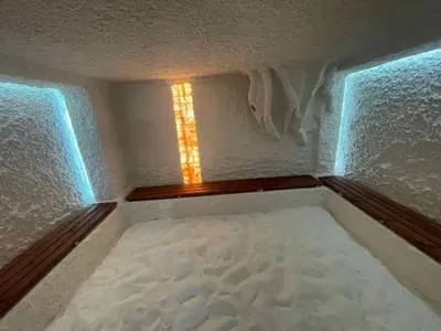 a small room with a bed with a window at Villa YoSi - apartments in Sapareva Banya