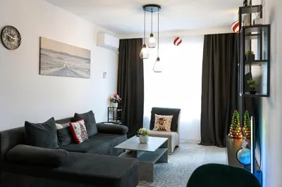 a living room with a couch and a table at Casa Vista - Spacious 2BR, 2Bath, Apartment in Sofia with 2 Free Parking in Sofia