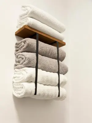a stack of towels on a towel rack at Casa Vista - Spacious 2BR, 2Bath, Apartment in Sofia with 2 Free Parking in Sofia
