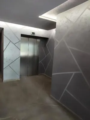 a elevator in a room with a wall of marble at Your Sweet Home in Sofia