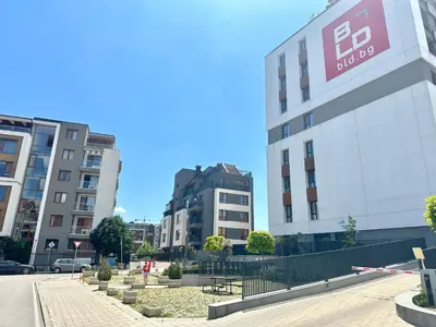 a street with two tall buildings in a city at Апартамент В 54 в Сграда МОНА in Sofia