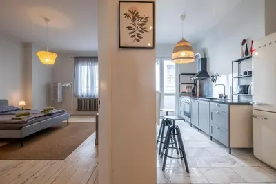 a kitchen and a living room with a couch at Spacious & Central 2BR with Terrace, Cozy & Modern by Flat Mаnager in Sofia