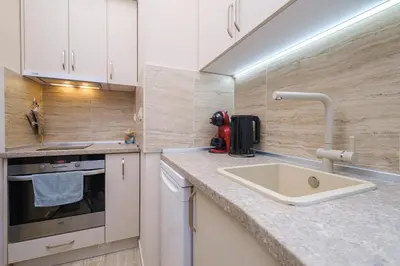 a kitchen with a sink and a counter top at Cozy Corner-Heart of Plovdiv in Plovdiv