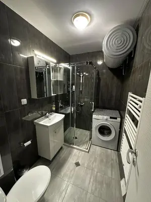 a bathroom with a shower sink and a toilet at Apartment Aria 6 in Velingrad