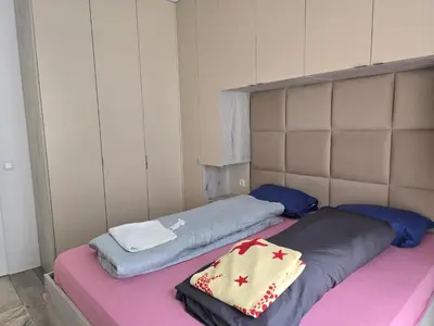 two beds sitting next to each other in a room at The Oligarchs Outlook in Sofia
