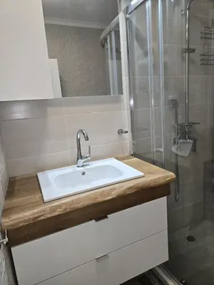a bathroom with a sink and a shower at The Oligarchs Outlook in Sofia
