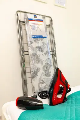 a pair of scissors sitting on top of a bed at Azuuro - 1BD near the city center by Flat Manager in Plovdiv
