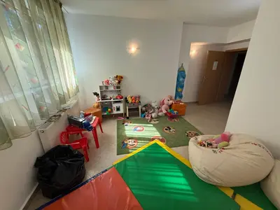 a room with two babies laying on the floor at Forest Retreat, Stream Resort, Pamporovo in Stoykite