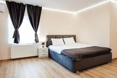 a bedroom with a bed and a window at Къща Инфинити Лукс и Уют, Вплетени в Спомени in Sapareva Banya