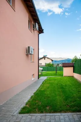 a view from the side of a pink building at Апартамент Инфинити in Sapareva Banya