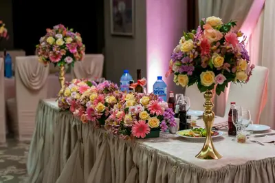 a table with flowers on top of it at Hotel Monte Cristo in Blagoevgrad