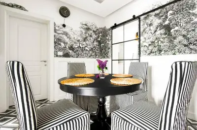 a dining room with a black table and two chairs at For Those Who Want the Best City Views and Style in Sofia