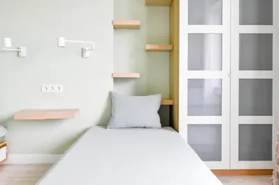 a bedroom with a bed and a glass door at For Those Who Want the Best City Views and Style in Sofia