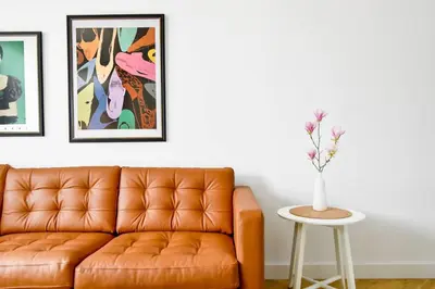 a living room with a couch and a table at For Those Who Want the Best City Views and Style in Sofia