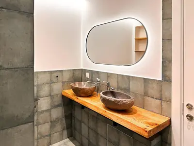 a bathroom with two sinks and a mirror at For Those Who Want the Best City Views and Style in Sofia