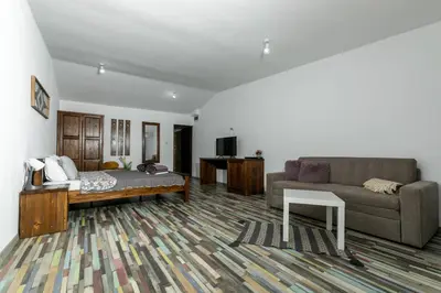 a large living room with a couch at Комплекс Варвара - Хотел и Минерални басейни in Varvara