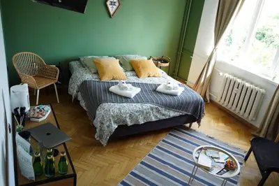 a bedroom with a bed with towels on it at NDK Skyline Studio in Sofia