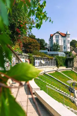 a park with graves and a building in the background at 1BR Apartment with a Free Designated Parking Space in Plovdiv