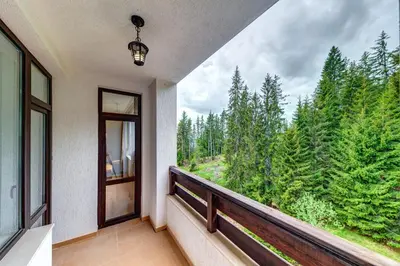 a balcony with a view of a forest at Forest Harmony 1BD with Balcony & Parking by Flat Manаger in Smolyan