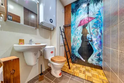 a bathroom with a toilet and a sink and a shower at Into the Woods - Charming Studio by Flat Manager in Smolyan