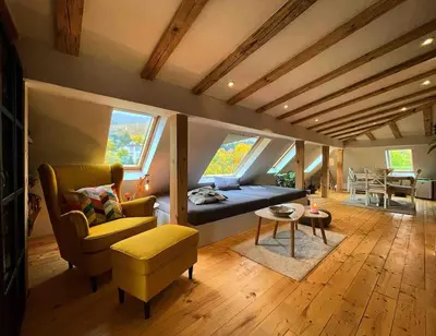 a living room with a couch and chairs and a table at Boutique apartment with Mountain View in Sofia