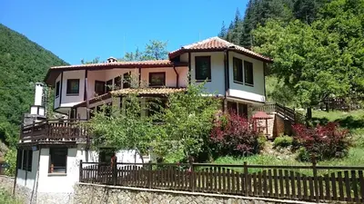 a house on a hill with a fence at Villa Persenk in Lyaskovo