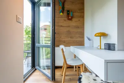 a kitchen with a white counter and a window at Arte Apartment in Sofia
