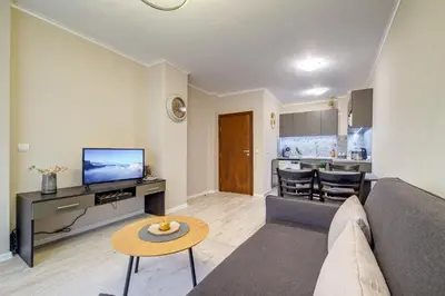 a living room with a couch and a table at Dream View 1BD - Quick Slope Access by Flat Manager in Pamporovo