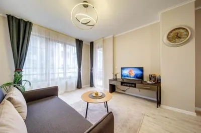 a living room with a couch and a tv at Dream View 1BD - Quick Slope Access by Flat Manager in Pamporovo