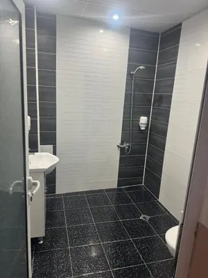 a bathroom with a shower and a sink at Комлекс Кристо in Blagoevgrad