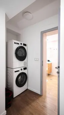 a laundry room with a washer and dryer at Cozy 1BD Apartment next to NDK by Flat Mаnager in Sofia