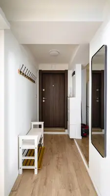 a living room with a table and a mirror at Cozy 1BD Apartment next to NDK by Flat Mаnager in Sofia