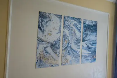 a picture of a blue and white painting on a wall at Comfy & Chic Apartment , SWU , FREE Parking in Blagoevgrad
