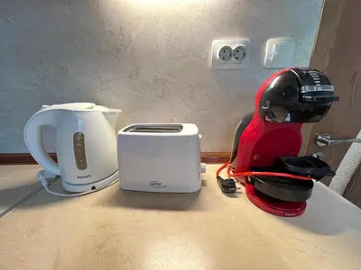 a counter with a toaster and a blender on it at Giza Cozy 1BDR w WiFi near Arena 8888 and SofiaMed in Sofia